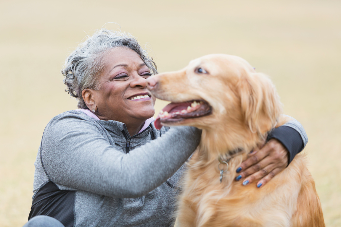 African American woman with pet dog