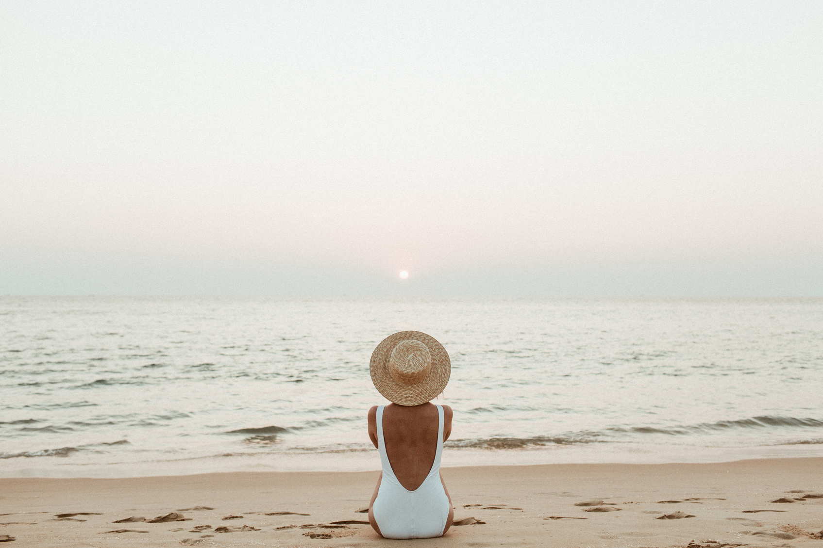 Woman Sitting on the Beach